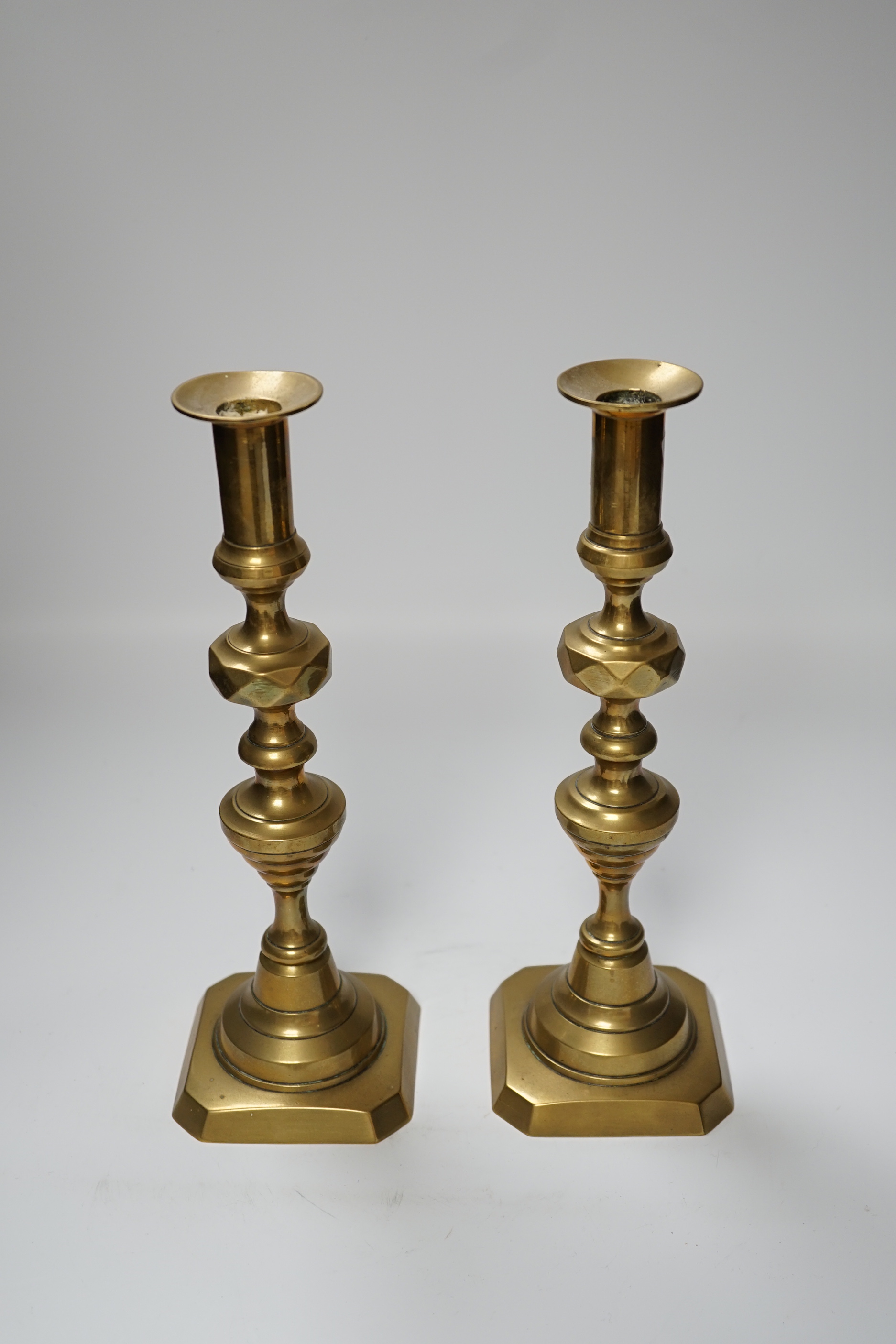 A pair of 19th century brass candlesticks, 30cm